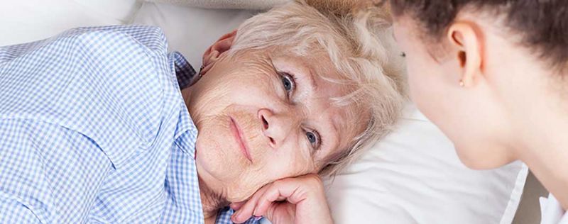 elderly woman in bed