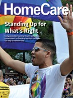 Cardinal Health employee holds Pride flag as a part of Cardinal's participation in local Pride parade