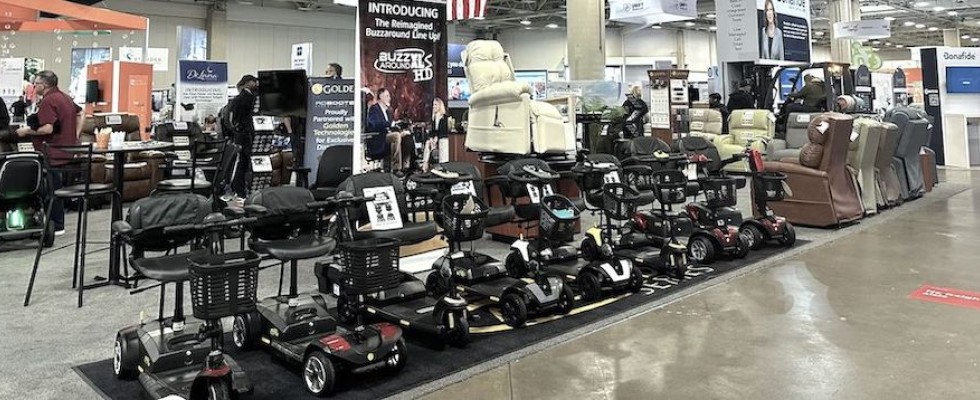 An image of mobility products lined up under a Golden sign at Medtrade 2024