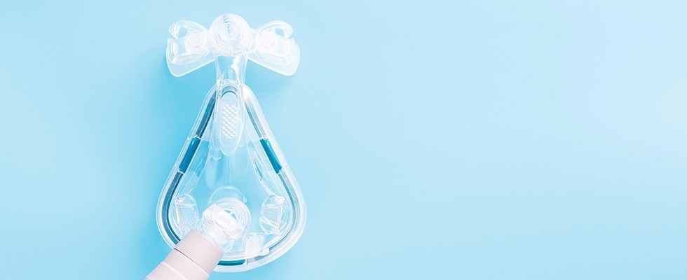 An image of a PAP mask on a blue background