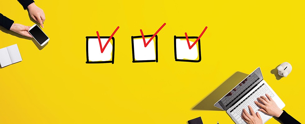 A yellow background with three checkmarks