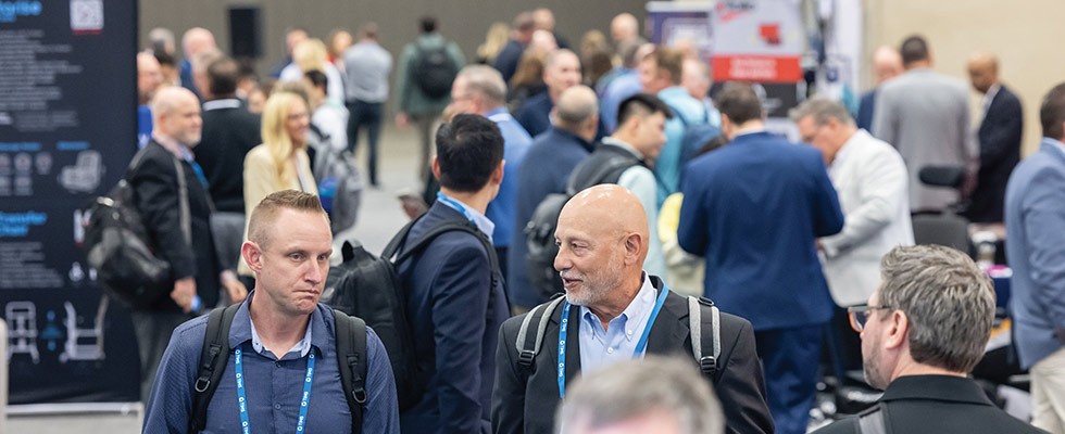 Attendees of Medtrade 2024 walk around the exhibition hall floor