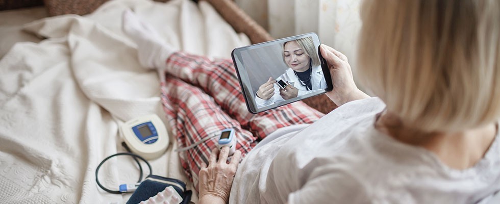 woman checking vital signs during telehealth appointment