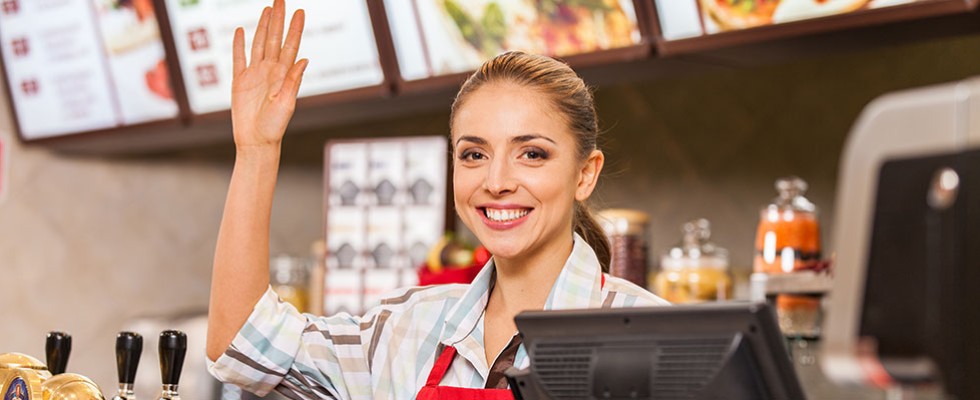 restaurant worker raising hand