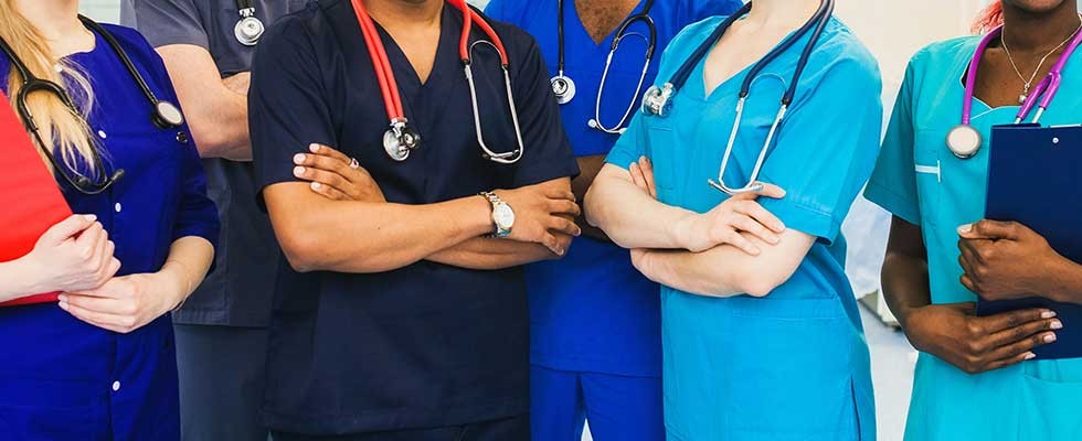 medical professionals standing in line