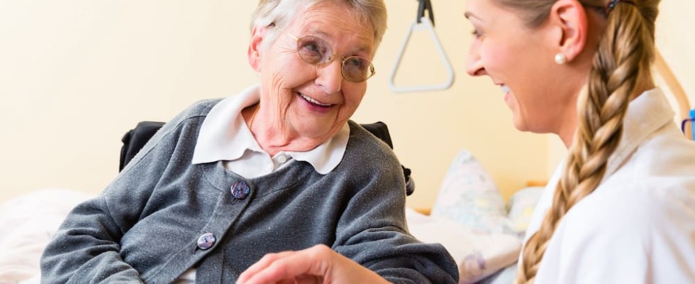 caregiver takes care of older woman