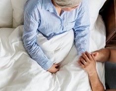 In-home cancer patient receiving bedside care.